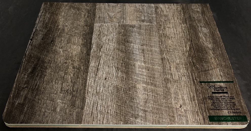 Carlton Flooring - Prime Collection Product: Manchester Dimensions: 6.5mm x 7" x 48" (0.5mm Wear Layer) Underpad: Attached Warranty: Lifetime Residential - 25 Years Commercial FloorScore Certified Code: CTS6501S