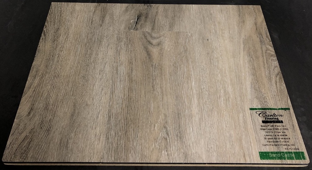 Carlton Flooring - Prime Collection Product: Sand Castle Dimensions: 8mm x 7" x 48" (0.5mm Wear Layer) Underpad: Cork Attached Warranty: Lifetime Residential - 25 Years Commercial FloorScore Certified