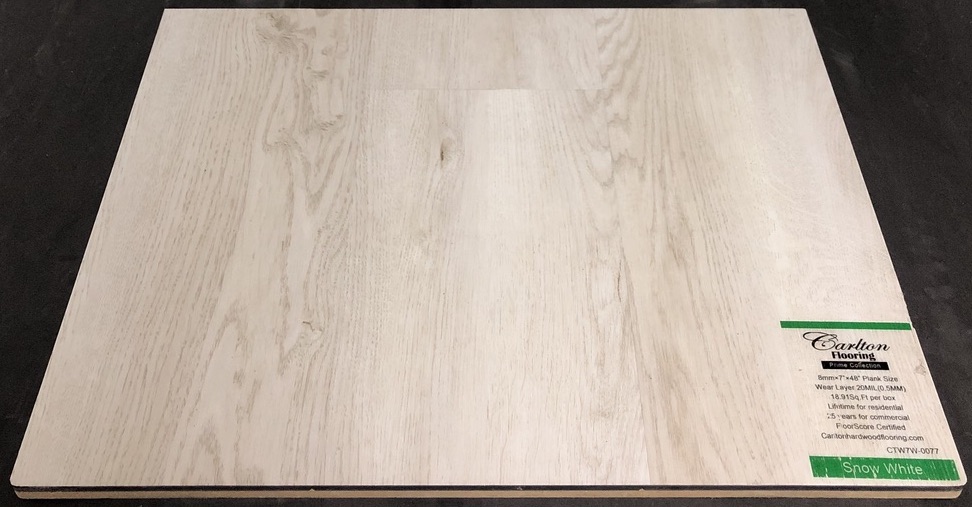Carlton Flooring - Prime Collection Product: Snow White Dimensions: 8mm x 7" x 48" (0.5mm Wear Layer) Underpad: Cork Attached Warranty: Lifetime Residential - 25 Years Commercial FloorScore Certified